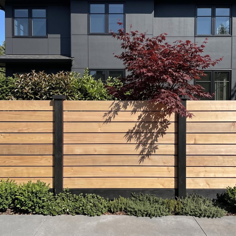 A modern timber privacy fence with horizontal boards, concealed fixings and three height options