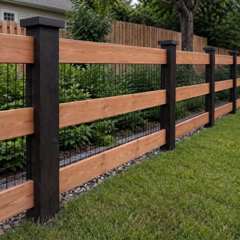 A three-rail cedar fence with welded wire infill and an optional matching gate